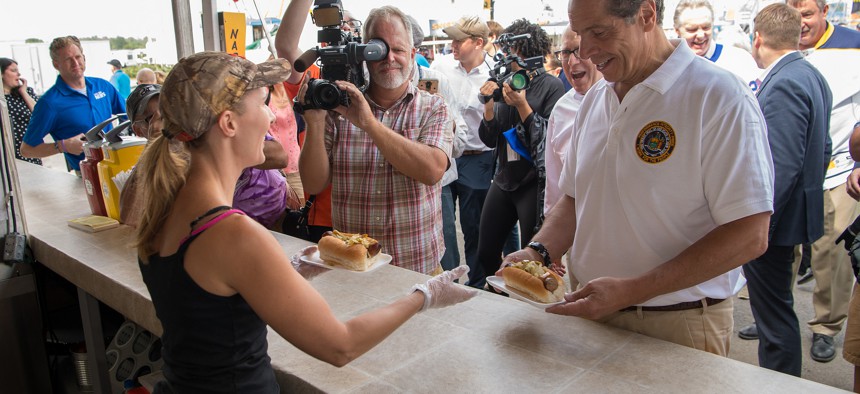 Andrew Cuomo sampling the fare at the 2018 Great New York State Fair. 