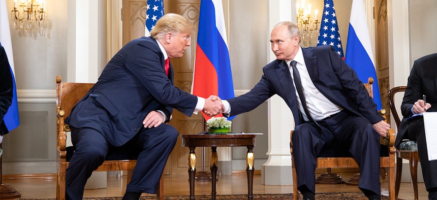 President Donald Trump shakes the hand of Russian President Vladimir Putin in Helsinki, Finland.