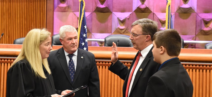 Assemblyman Brian Miller being sworn in.