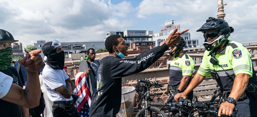 Black Lives Matter protestors confronted by the NYPD on the Brooklyn Bridge on July 15th.