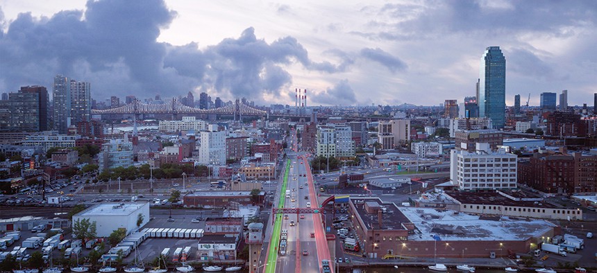 A rendering of the proposed BQX traveling over the Pulaski Bridge in Brooklyn.