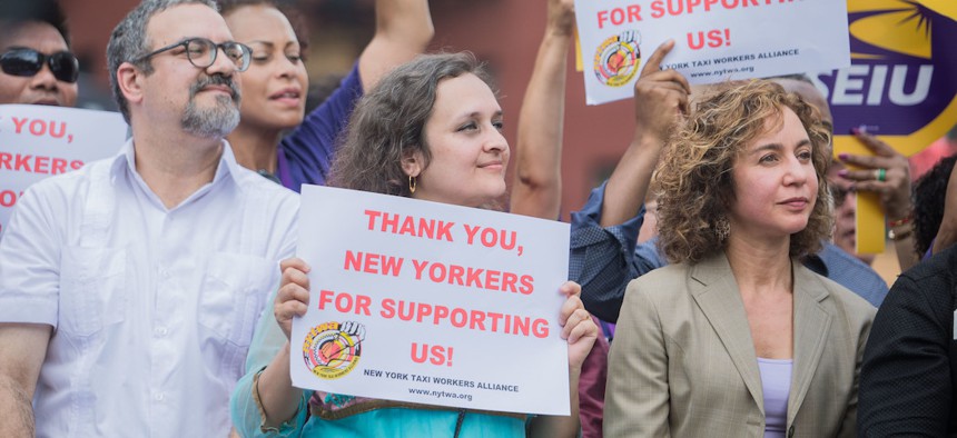 Bhairavi Desai (center), executive director of the New York Taxi Workers Alliance.