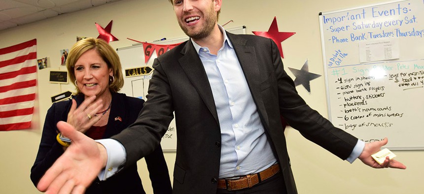 Eric Trump, right, son of President Donald Trump, enters a rally for U.S. Rep. Claudia Tenney at her campaign headquarters in New Hartford.