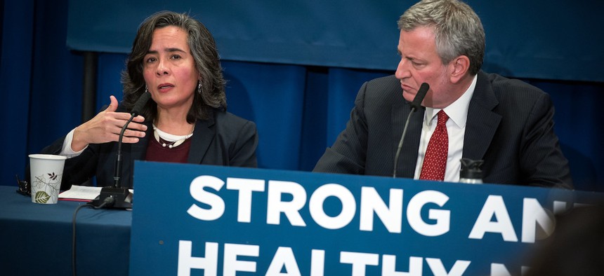 Dr. Oxiris Barbot, Commissioner of New York City’s Department of Health and Mental Hygiene, alongside Mayor de Blasio.