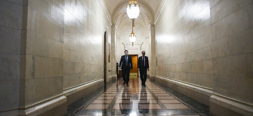 New York State Senate Deputy Majority Leader Michael Gianaris (right) and NYS Senate Deputy Counsel Eric Katz walk to the Senate chamber after a rules meeting during session on June 10th.