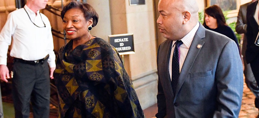Senate Majority Leader, Andrea Stewart-Cousins and Assembly Speaker Carl Heastie walk past the Senate Chamber in Albany, N.Y