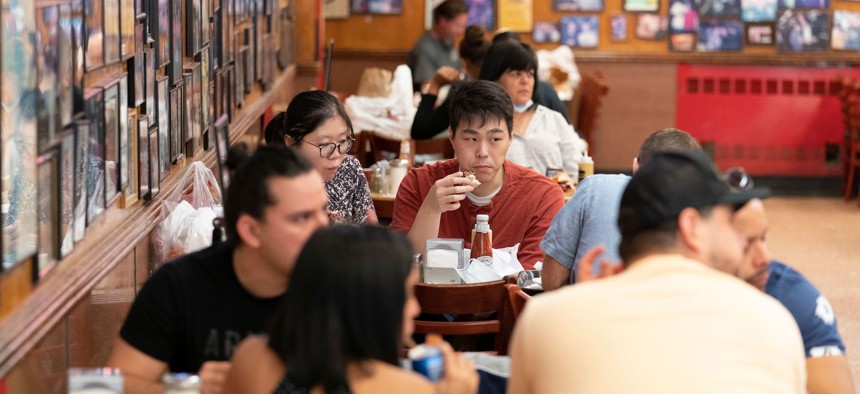 People dining indoors at Katz Delicatessen on September 30, 2020.