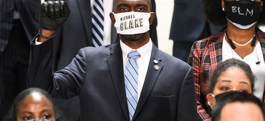 Assembly Member Michael Blake stands in solidarity with Assembly members in favor of new legislation for Police Reform during a news briefing at the state Capitol, in Albany on June 8th.