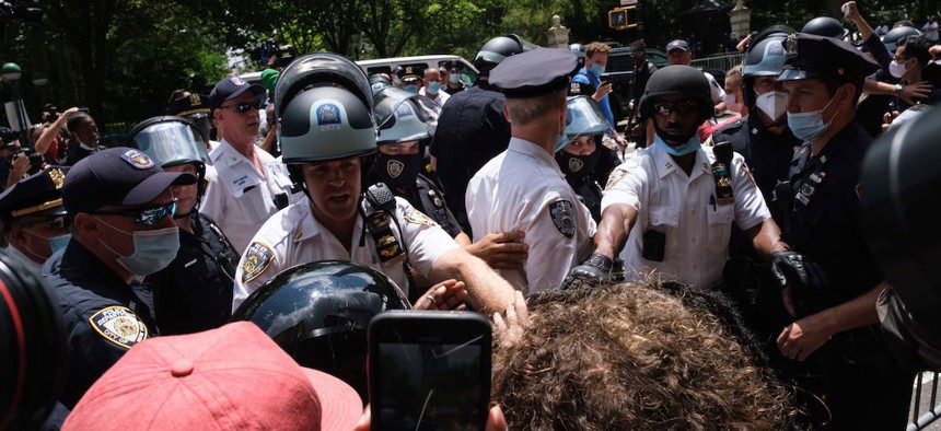 Black Lives Matter protesters and NYPD officers have a confrontation near City Hall Park.