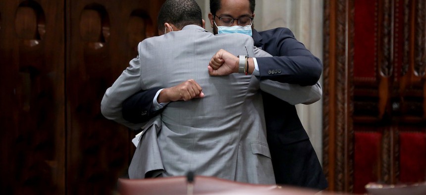 NYS Senator Jamaal Bailey hugs NYS Senator Zellnor Myrie after passing the bill to repeal Section 50-A.