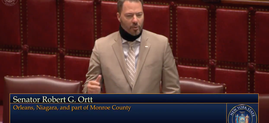 State Senator Robert Ortt protesting the removal of the law banning the wearing of masks in public.