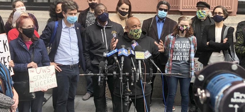 Shams DaBaron, center, an advocate for the city’s homeless and a resident at the Lucerne. 