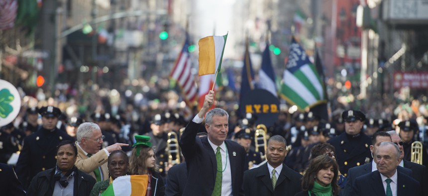 Mayor Bill de Blasio and First Lady Chirlane McCray marching in the 2016 St. Patrick's Day Parade.