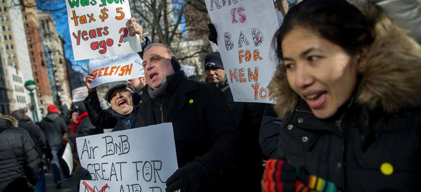 Airbnb protestors outside the gates of New York City Hall in Manhattan.