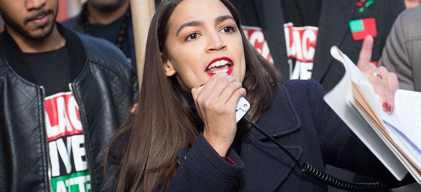 Alexandria Ocasio-Cortez early in her campaign, speaking at the 'Future of the City' rally and youth march hosted by Black Lives Matter of Greater New York.