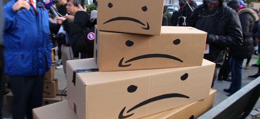 Props inverting Amazon's trademark logo were a mainstay at numerous protests against the company's proposed HQ2 in Queens last year.