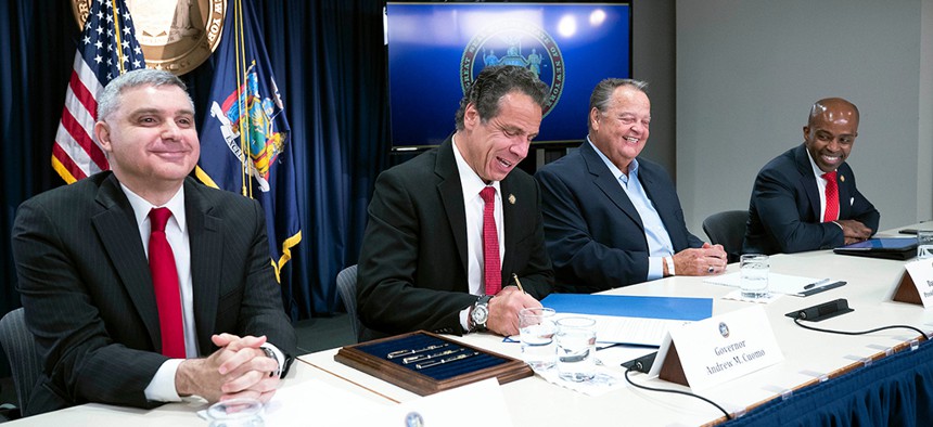 Governor Andrew M. Cuomo signs an executive order to protect union members from harassment and intimidation.