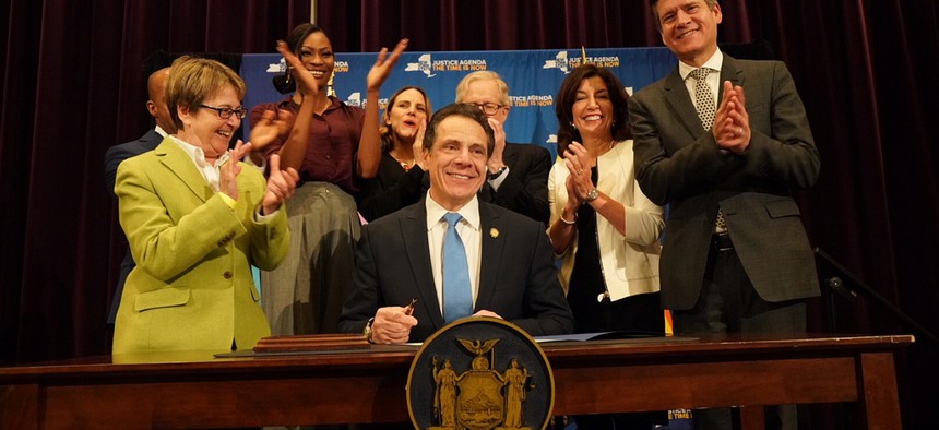 Gov. Andrew Cuomo signs the Gender Expression Non-Discrimination Act into law.