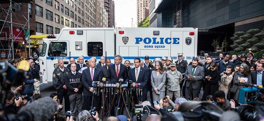 Mayor Bill de Blasio, Governor Andrew Cuomo and Police Commissioner James O'Neill hold a press conference outside the Time Warner Center in Manhattan after the NYPD Bomb Squad removed an explosive device from the building on Wednesday, October 24, 2018.