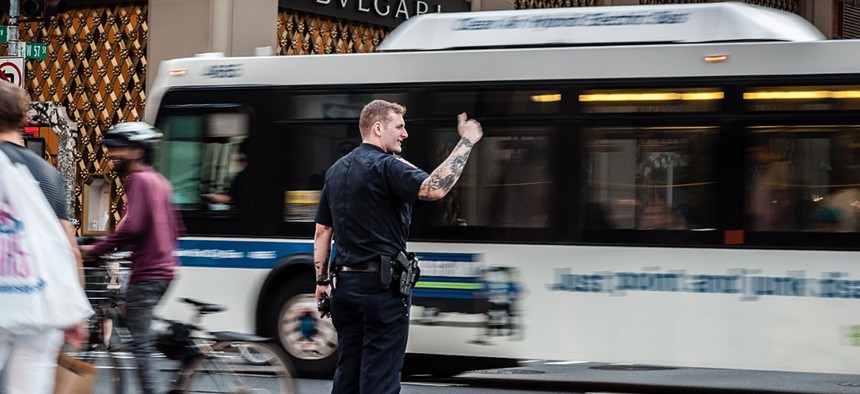 An NYPD officer directs traffic in the midst of a blackout affecting Midtown and the Upper West Side in Manhattan on July 13.