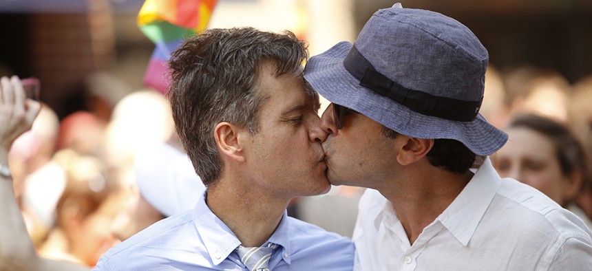 State Sen. Brad Hoylman kissing his husband, David Ivan Sigal, during New York City's Pride parade.