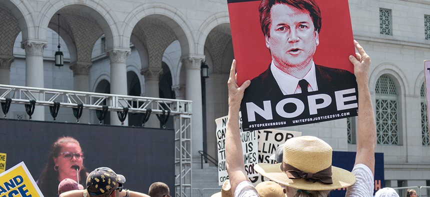 Protestors outside the Supreme Court gather in opposition of Donald Trump’s nomination of Brett Kavanaugh.