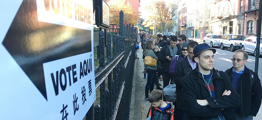 Voters wait in line to cast their ballot during the 2016 election at PS 8 in Brooklyn.