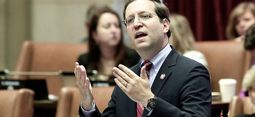 New York Assemblyman David Buchwald addressing members of the state Assembly.