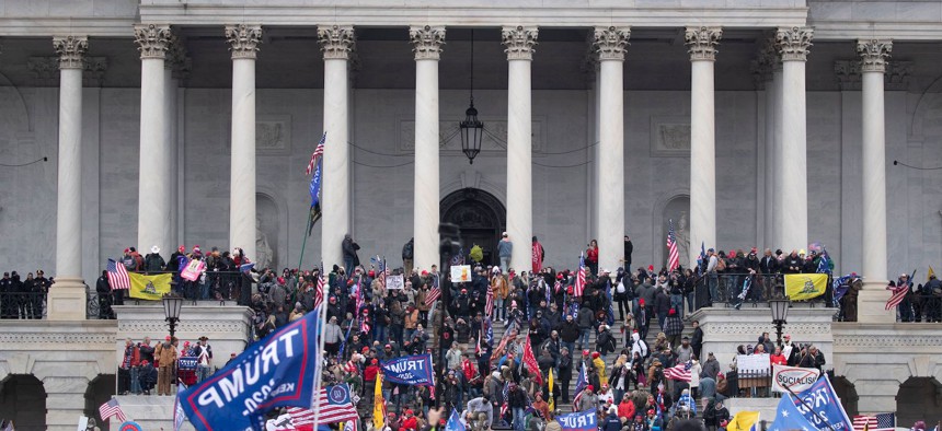 Pro-Trump supporters storm the grounds of the East Front of the US Capitol.