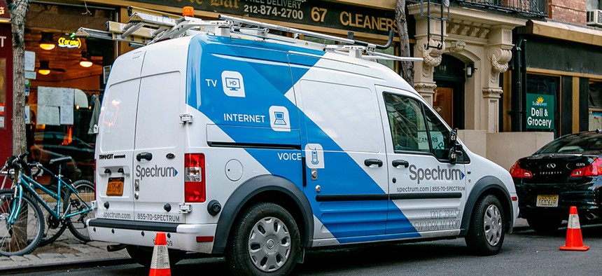 A Charter Spectrum van parked on the streets of Manhattan.