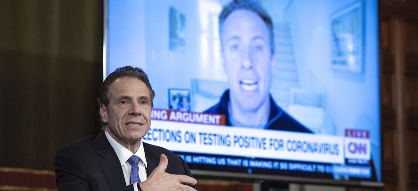 Governor Cuomo shows a slide of his brother, Chris Cuomo, reporting from his basement after being diagnosed with the coronavirus.