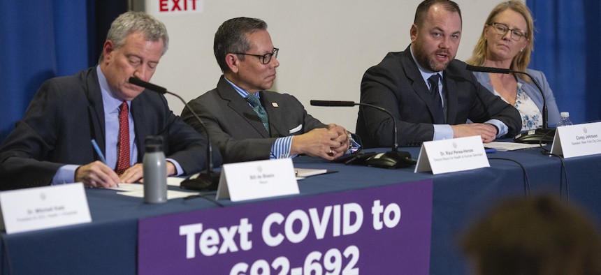 City Council Speaker Corey Johnson joins Mayor de Blasio at a COVID-19 media briefing in early March.