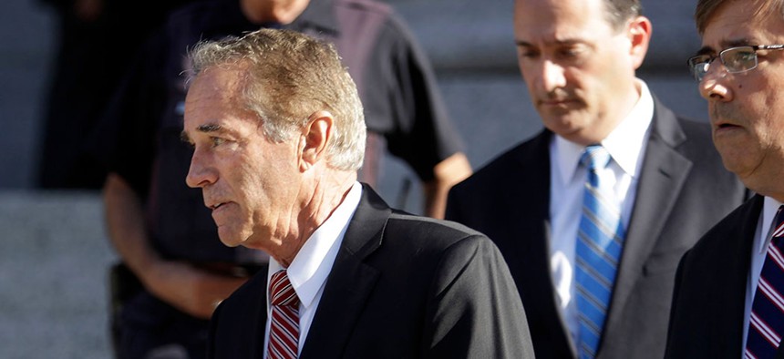 Former Rep. Chris Collins leaves federal court, in New York. 