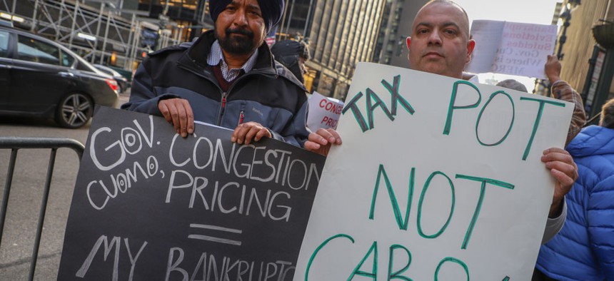 Yellow and Green Cab drivers protesting last year outside of Gov. Andrew Cuomo's Midtown office against the congestion charge for Manhattan drivers.