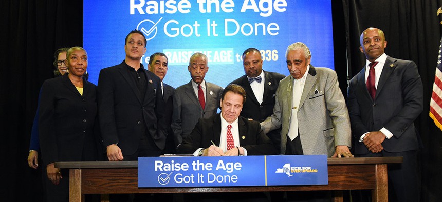 Gov. Andrew Cuomo signing "Raise The Age" into law in 2017. 