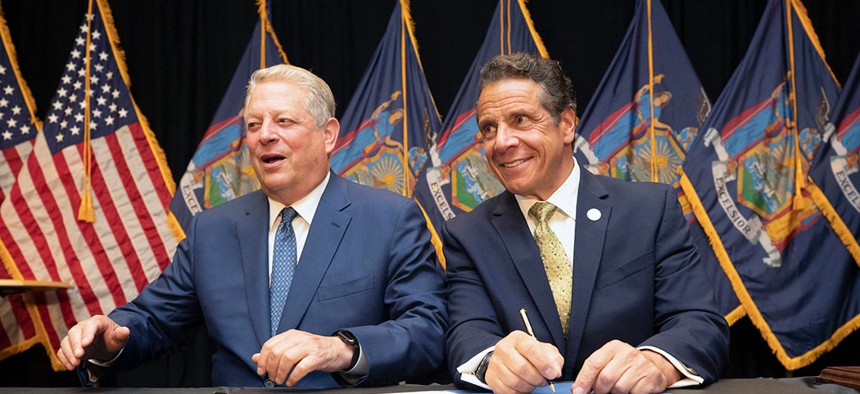Governor Andrew M. Cuomo delivers comments during an offshore wind event in New York, accompanied by environmentalist and former Vice President Al Gore.