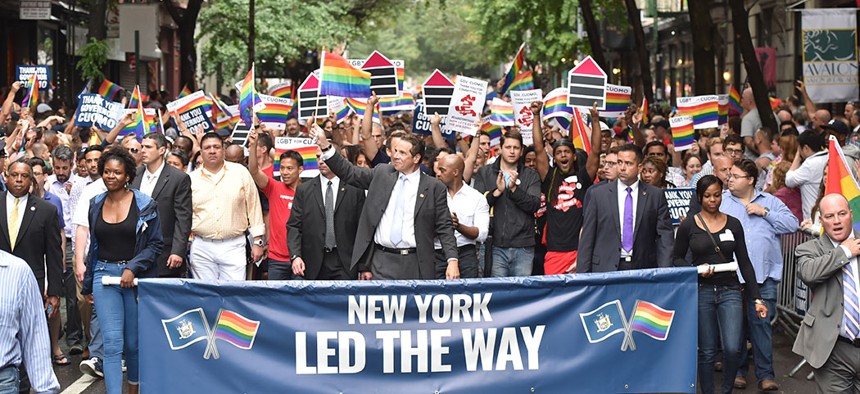 Gov. Andrew Cuomo smiles and waves in the 2015 New York City Pride.