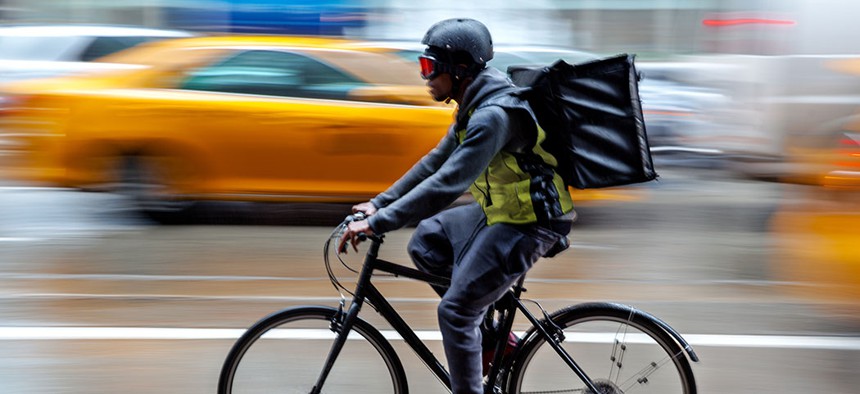 A delivery cyclist.