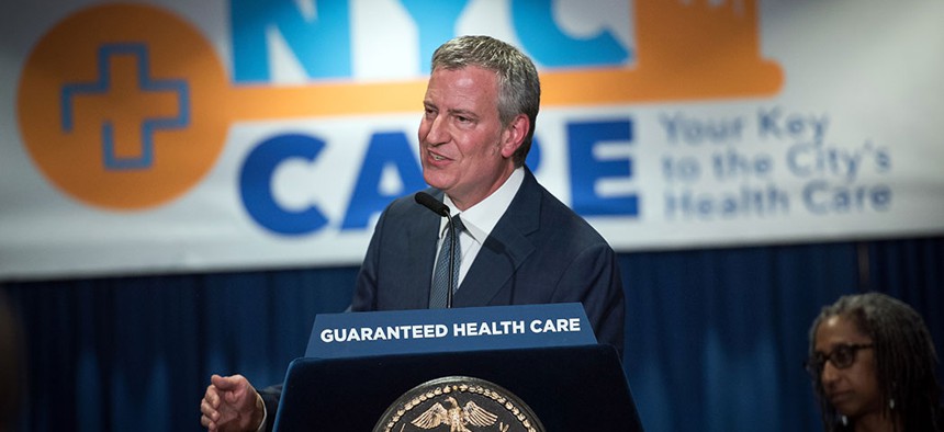 New York City Mayor Bill de Blasio announcing guaranteed health care for New Yorkers in May. 