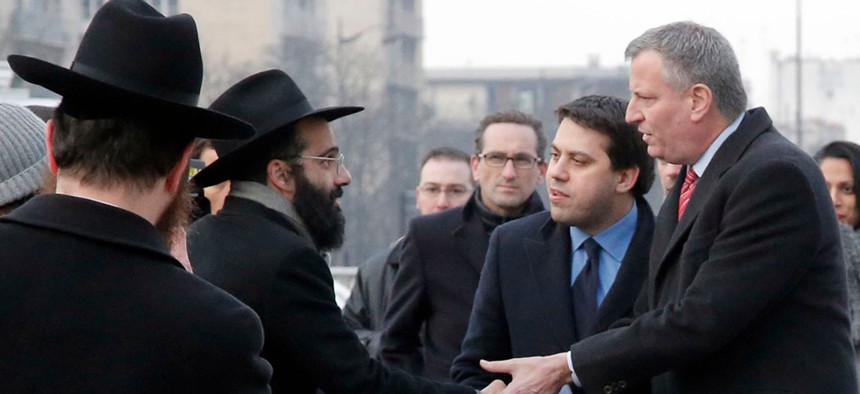 New York City Mayor Bill de Blasio greets Jewish community members.