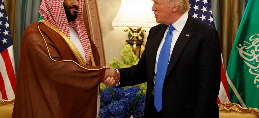 President Donald Trump shakes hands with Saudi Deputy Crown Prince and Defense Minister Mohammed bin Salman during a bilateral meeting, in Riyadh.