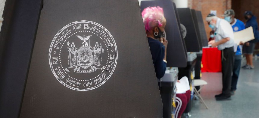 Early voters cast their ballot at a polling station inside the Brooklyn Museum on June 16th.