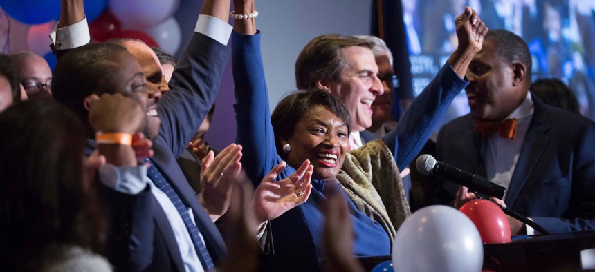 New York State Sen. Andrea Stewart-Cousins celebrates her re-election with other New York State Senate victors during the Nassau County Democratic Committee election night event in November 2018.