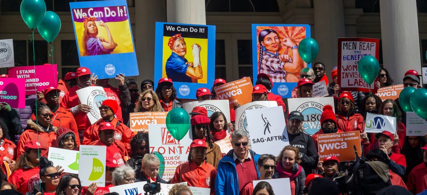 Activists on the steps of New York City Hall on Equal Pay Day in 2019.