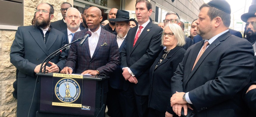Brooklyn Borough President Eric Adams addresses the crowd during a press conference outside a Jewish family services center in Midwood.