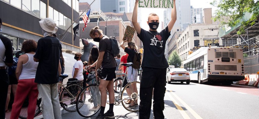 People participate in a protest calling on New York to cancel rent outside of a New York Civil Court in Brooklyn on July 7, 2020.