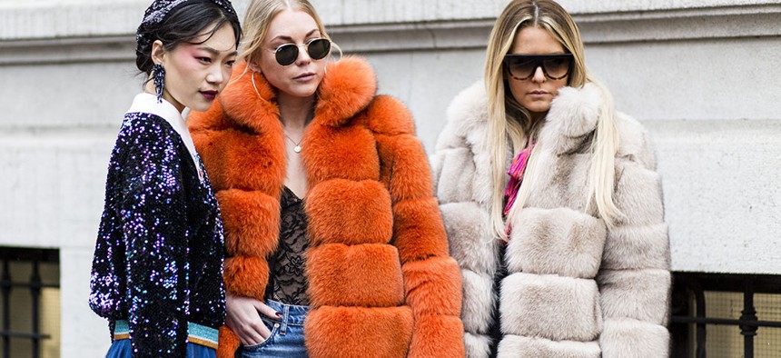 Fashion models sporting luxe faux-fur looks.