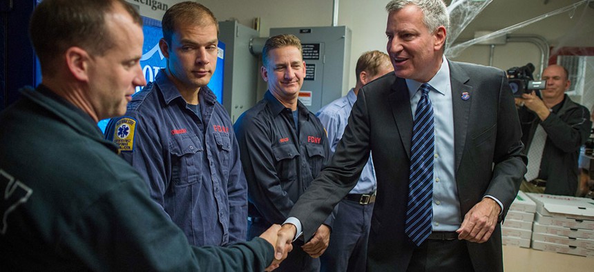 Mayor Bill de Blasio visits FDNY EMS Station 10 to thank FDNY members for their service in 2014.