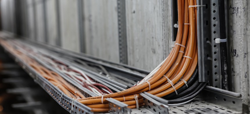 Fiber optic network cables on rails.