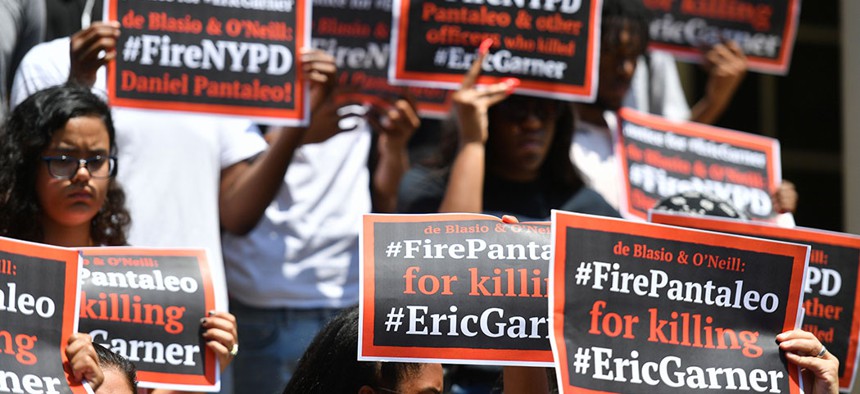 Protestors at a press conference regarding the DOJ's decision to decline pursuing federal charges against New York City police officer Daniel Pantaleo.